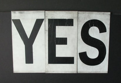 Antique tin movie marque letters “YES”.