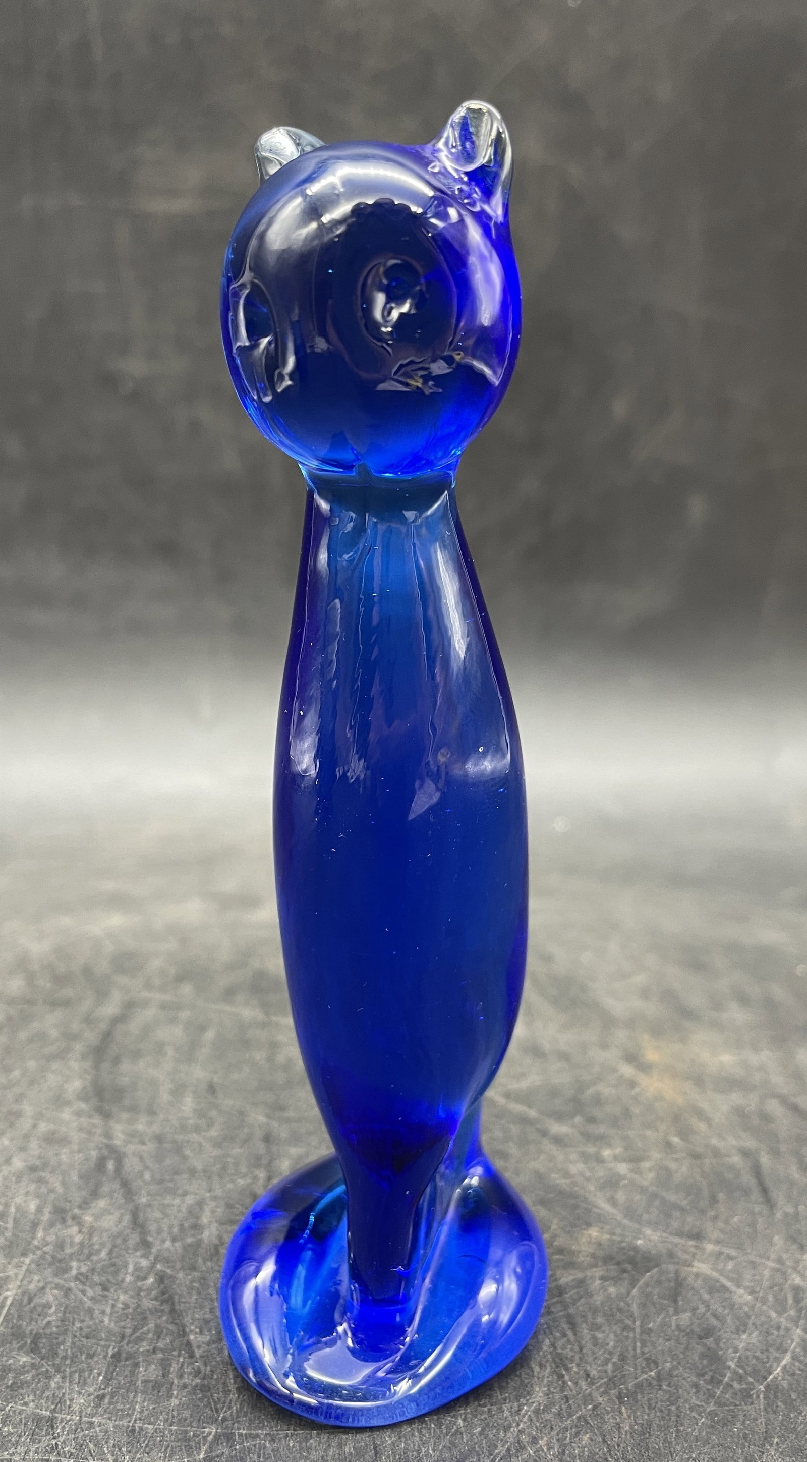 MCM Art Glass Cobalt Blue Cat Figurine: Title: MCM Art Glass Cobalt Blue Cat Figurine Date/Period: unknown Dimension: Approx. 5" tall Material: glass Additional Information: MCM Art Glass Cobalt Blue Cat Figurine Shipping: Domestic: Flat-ra