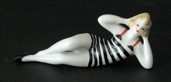 Antique porcelain bathing beauty figurine.