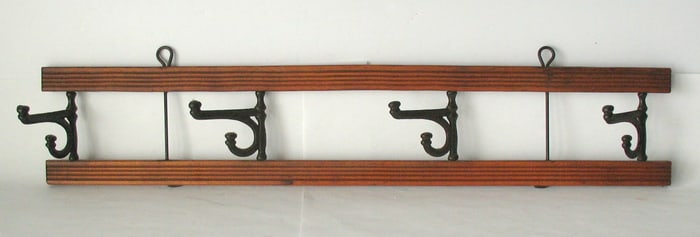 Antique wood & cast iron hat or coat rack.