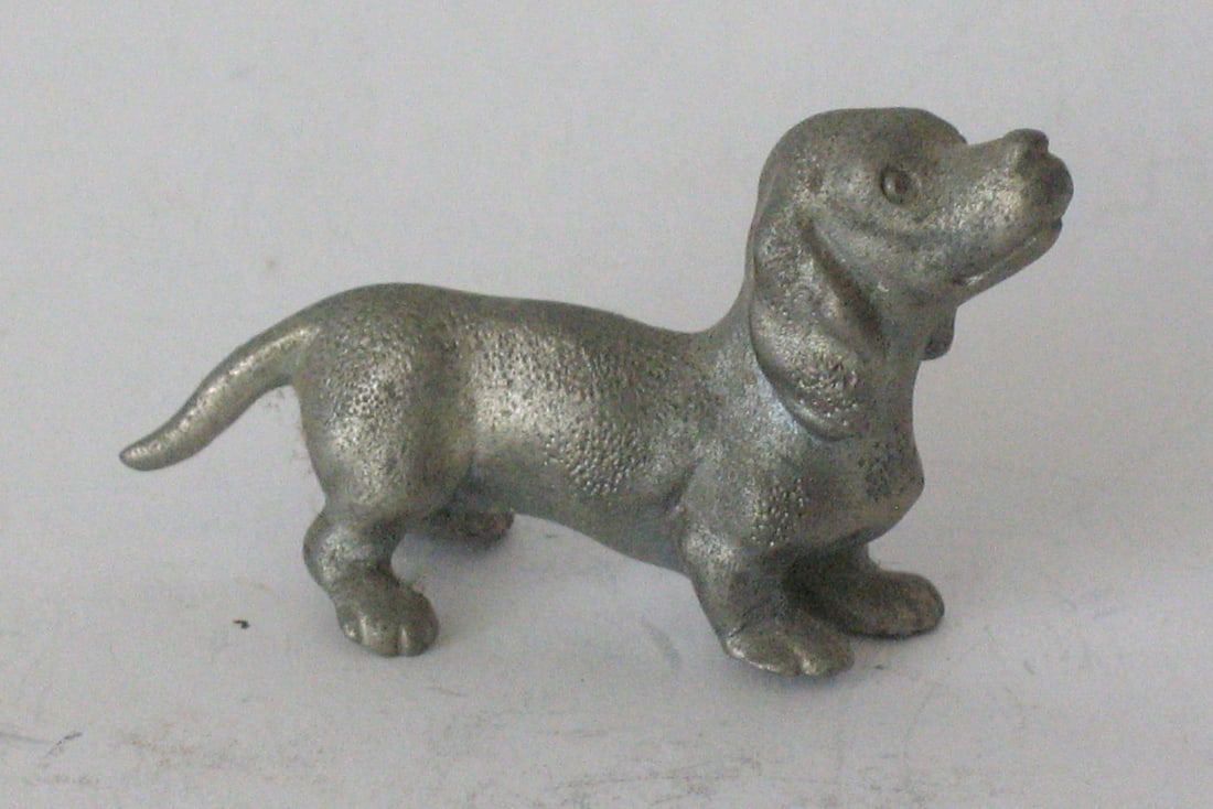 Vintage cast pewter Dachshund paper weight.: Title: Vintage cast pewter Dachshund paper weight. Date/Period: 1950's Dimension: 2” long Additional Information: Nice vintage cast pewter Dachshund paper weight in great all original condition.