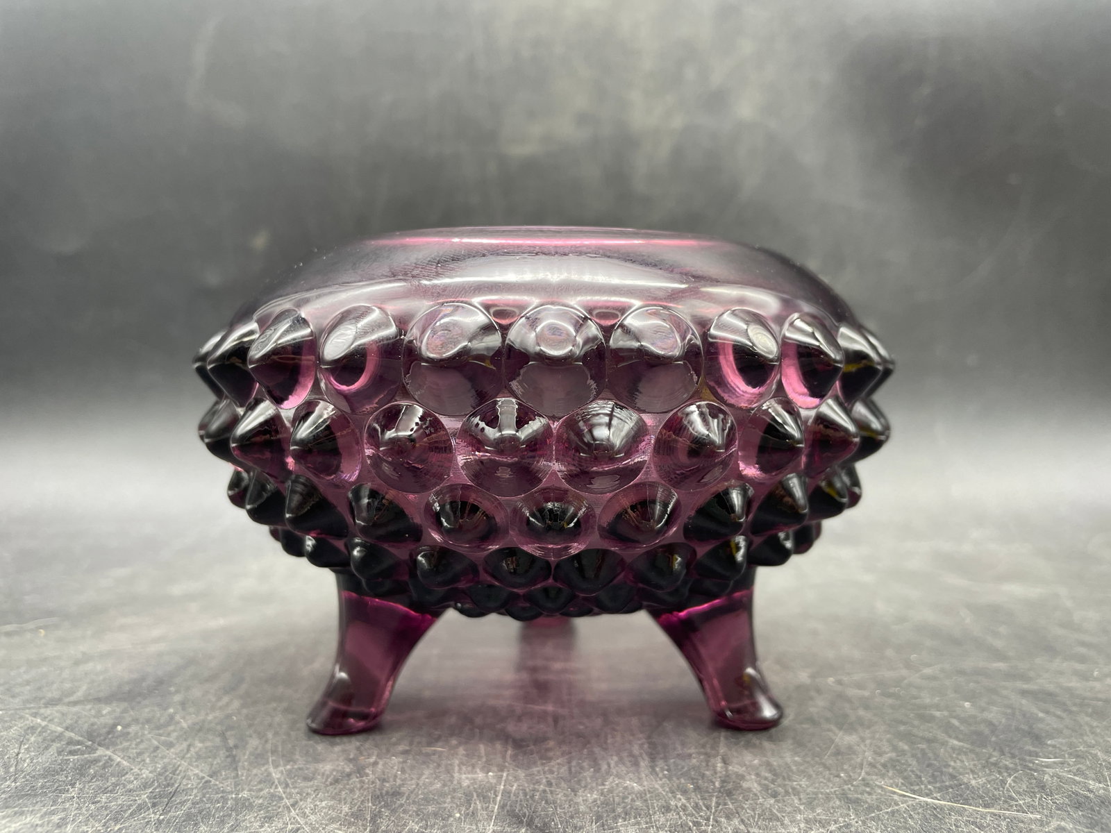 Viking Glass Amethyst Purple Hobnail 3-Footed Vase Bowl: Title: Viking Glass Amethyst Purple Hobnail 3-Footed Vase Bowl Date/Period: unknown Dimension: Apporx. 3" tall x 5" diameter 3" opening Material: glass Additional Information: Viking Glass Amethyst Pu