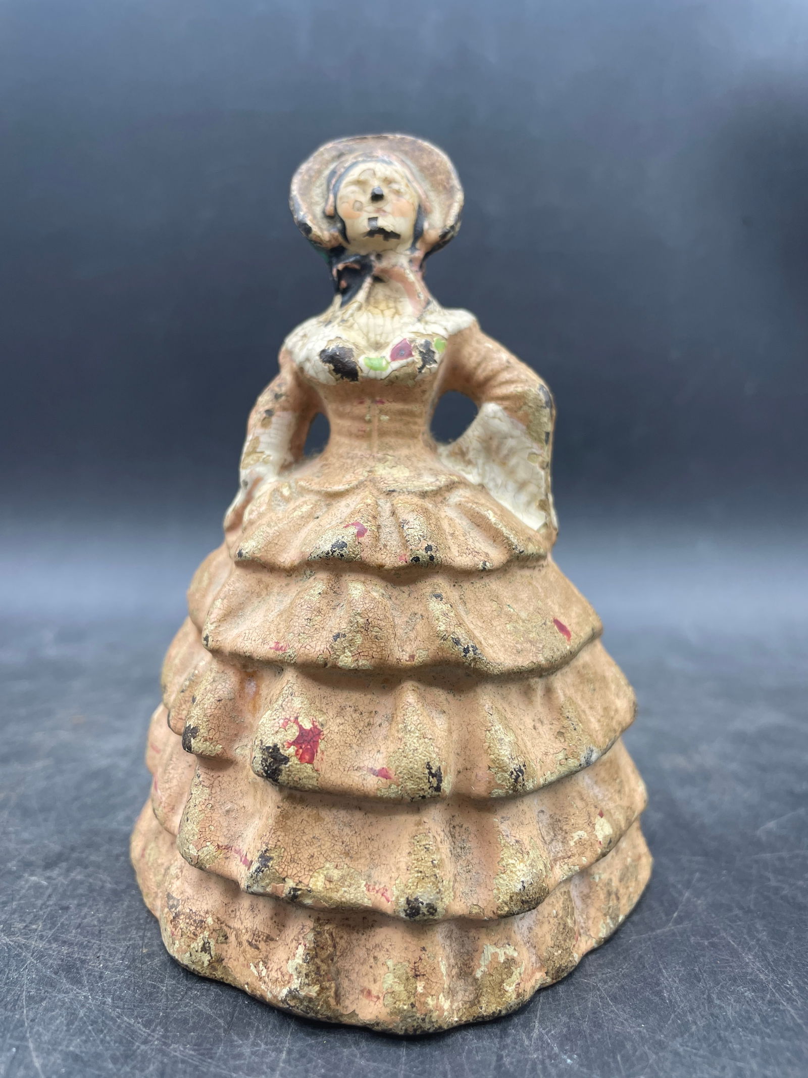 Cast Iron Doorstop Victorian Lady: Title: Cast Iron Doorstop Victorian Lady Date/Period: Dimension: Approx. 4.5 x 3 Material: cast iron Additional Information: Cast Iron Victorian Lady With Bonnet and Pink Frilly Dress Shipping: Domest