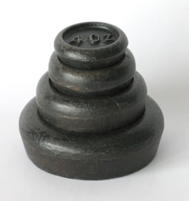 Set of antique cast iron country store scale weights.