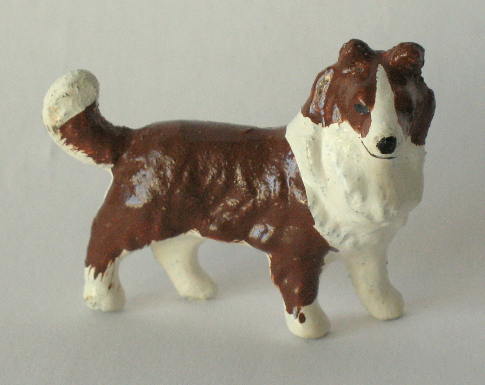 Vintage cast iron Collie paper weight.: Title: Vintage cast iron Collie paper weight. Date/Period: 1950's Dimension: 2 1/4” long Additional Information: Nice vintage cast iron Collie paper weight in original paint, patina & condition.