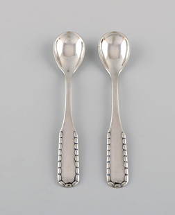 Two early Georg Jensen Rope salt spoons in silver (830). Dated 1909-1914.: Title:Two early Georg Jensen Rope salt spoons in silver (830). Dated 1909-1914. Description:Two early Georg Jensen Rope salt spoons in silver (830). Dated 1909-1914. Length: 9 cm. In excellent conditi