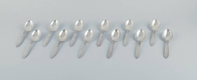 Georg Jensen, Kaktus, a set of twelve sterling silver dessert spoons.: Title:Georg Jensen, Kaktus, a set of twelve sterling silver dessert spoons. Description:Georg Jensen, Kaktus, a set of twelve sterling silver dessert spoons. Stamped with the post 1944 hallmark. In ex