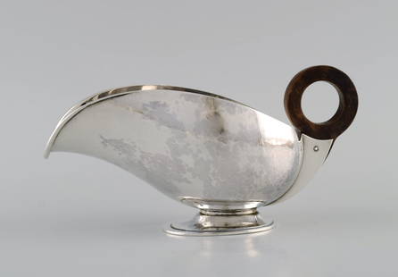 Hans Hansen (1884 - 1940), Denmark. Art deco / funkis sauce jug in sterling silver with handle in: Title:Hans Hansen (1884 - 1940), Denmark. Art deco / funkis sauce jug in sterling silver with handle in ebony. Dated 1938. Description:Hans Hansen (1884 - 1940), Denmark. Art deco / funkis sauce jug i