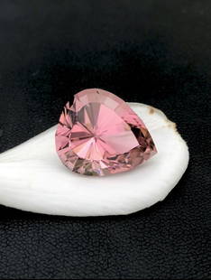 19.02 Carat Natural Stunning Pink Tourmaline: Dimensions (mm) 18.000 x 15.300 x 12.200 mm Weight (cts) 19.020 Treatment No Treatment Shape Fancy Type Faceted Clarity VVS Tourmaline is extremely popular among collectors and is a well-known gemston
