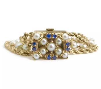 Vintage Nelmor Pearl and Sapphire Bracelet Watch in 14K Yellow Gold, 30.7 Grams: Vintage Nelmor Pearl and Sapphire Bracelet Watch in 14K Yellow Gold, 30.7 Grams This gorgeous vintage timepiece will add style to any attire. Please let us know if you have any questions. Circa: 1940'