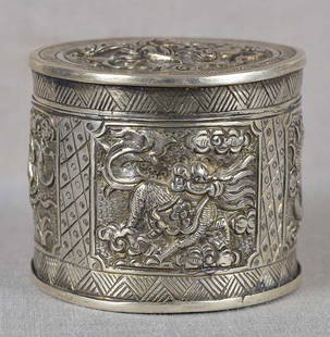 19c Chinese silver OPIUM BOX dragon phoenix qilin tortoise: 19th century Chinese silver opium box decorated in low relief: its top with a phoenix in flight among clouds, the bottom with flowering gnarled prunus tree, and the sides with 4 panels depicting four