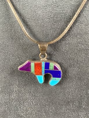 Lovely Native American Zuni Sterling Silver Medicine Bear Necklace With Inlaid Stones By Randi: The necklace is in very good condition. The pendant has what appears to be Randy Mahooty's hallmark and the word 'Sterling.' It has inlaid stones that are possibly coral, turquoise, opal, sugilite and