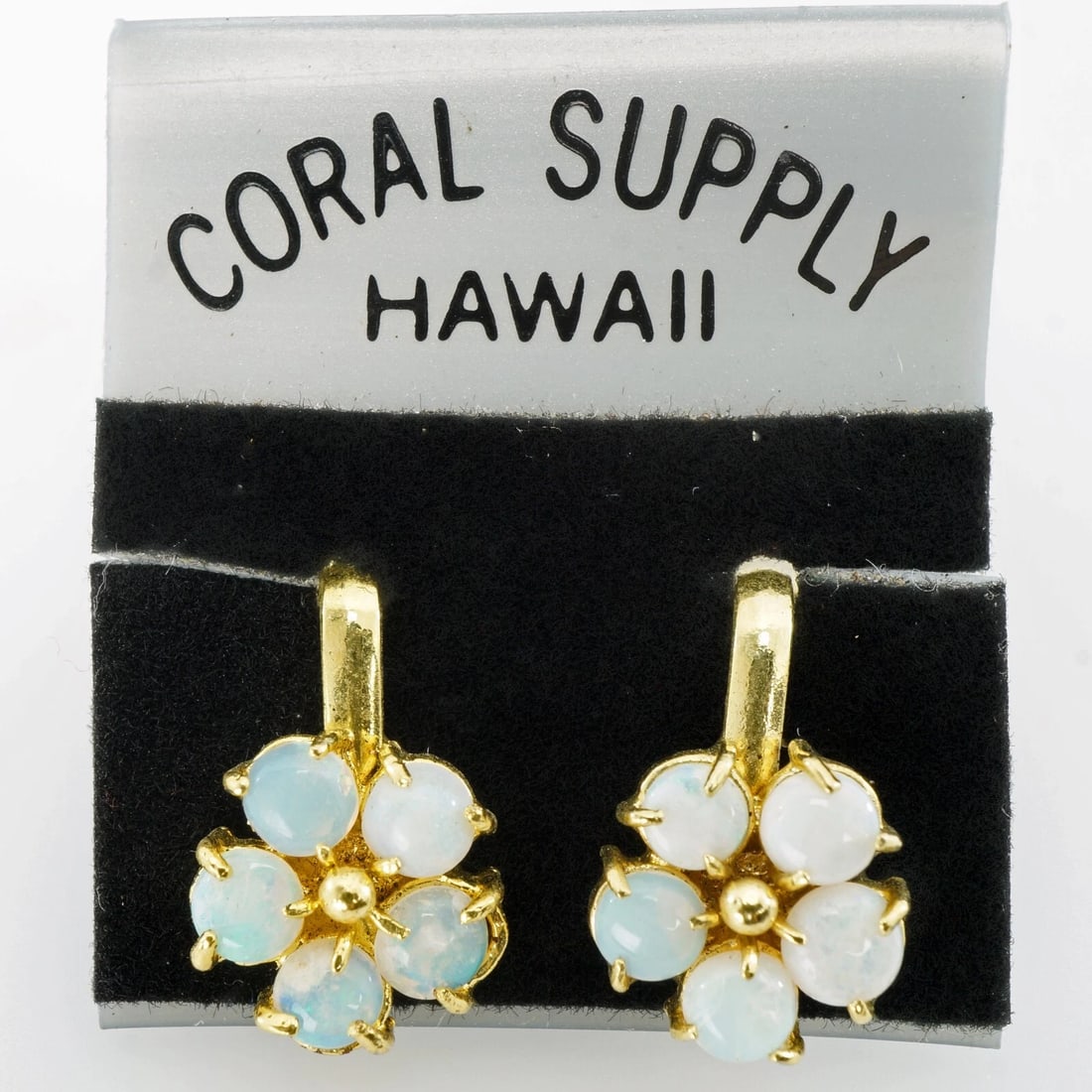 Vintage Opal Flower Clip Earrings: Title:Vintage Opal Flower Clip Earrings Size:½ in tall Description:Breathtaking round opals form iridescent petals on these flower clip earrings. The mounts are gold tone. The earrings are have n