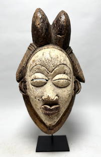 Funeral mask Punu , Gabon - Africa: Old Punu funeral mask. This funeral mask and thereafter used as entertainment mask worn by professional dancers stiltwalkers. Punu masks represent idealized female ancestors' faces. The white color of
