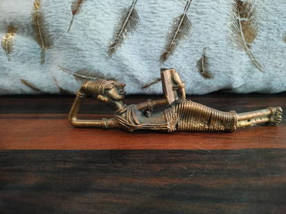 Ancient Sculpture of a queen reading a book: Title:Ancient Sculpture of a queen reading a book Origin:Rajput Era Date/Period:19th Century Materials:Brass Size:15cm*2.5cm*4.5cm Description:This is an ancient sculpture of queen reading a book, acq