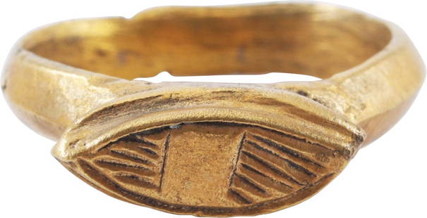 FINE ROMAN SIGNET RING 1ST-3RD CENTURY AD, SIZE 3 ½: Gilt bronze, size 3 &#189; for the small finger as was the custom, with ridged band. The base, 3.2mm with a fully modeled base lug in the Roman taste. Flared to the shoulders with raised lenticular be