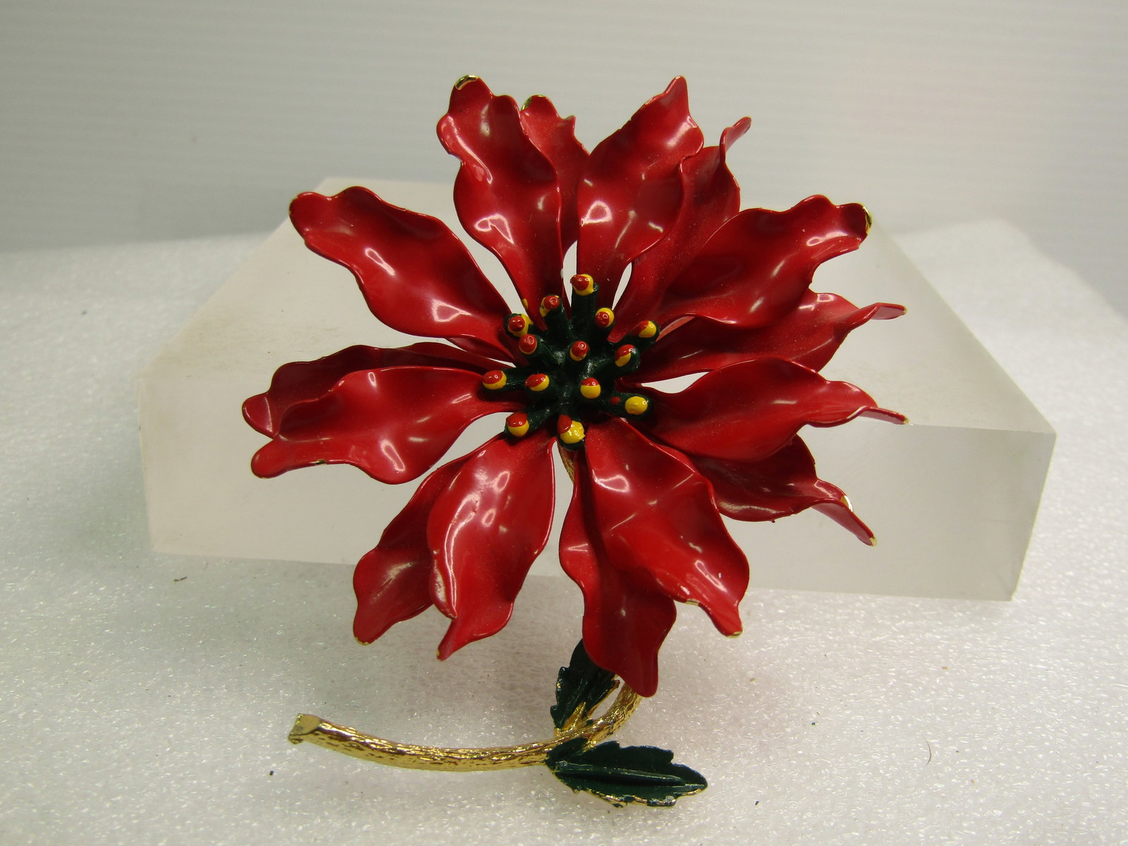 Vintage Enameled Poinsettia Floral Stem Brooch, 3" 1950's-1960's: Vintage Enameled Poinsettia Floral Stem Brooch, 3" 1950's-1960's. Great for the floral enthusiast and great for Christmas too. This is 3" tall and slightly over 2.75" wide. The stem is gold tone and c
