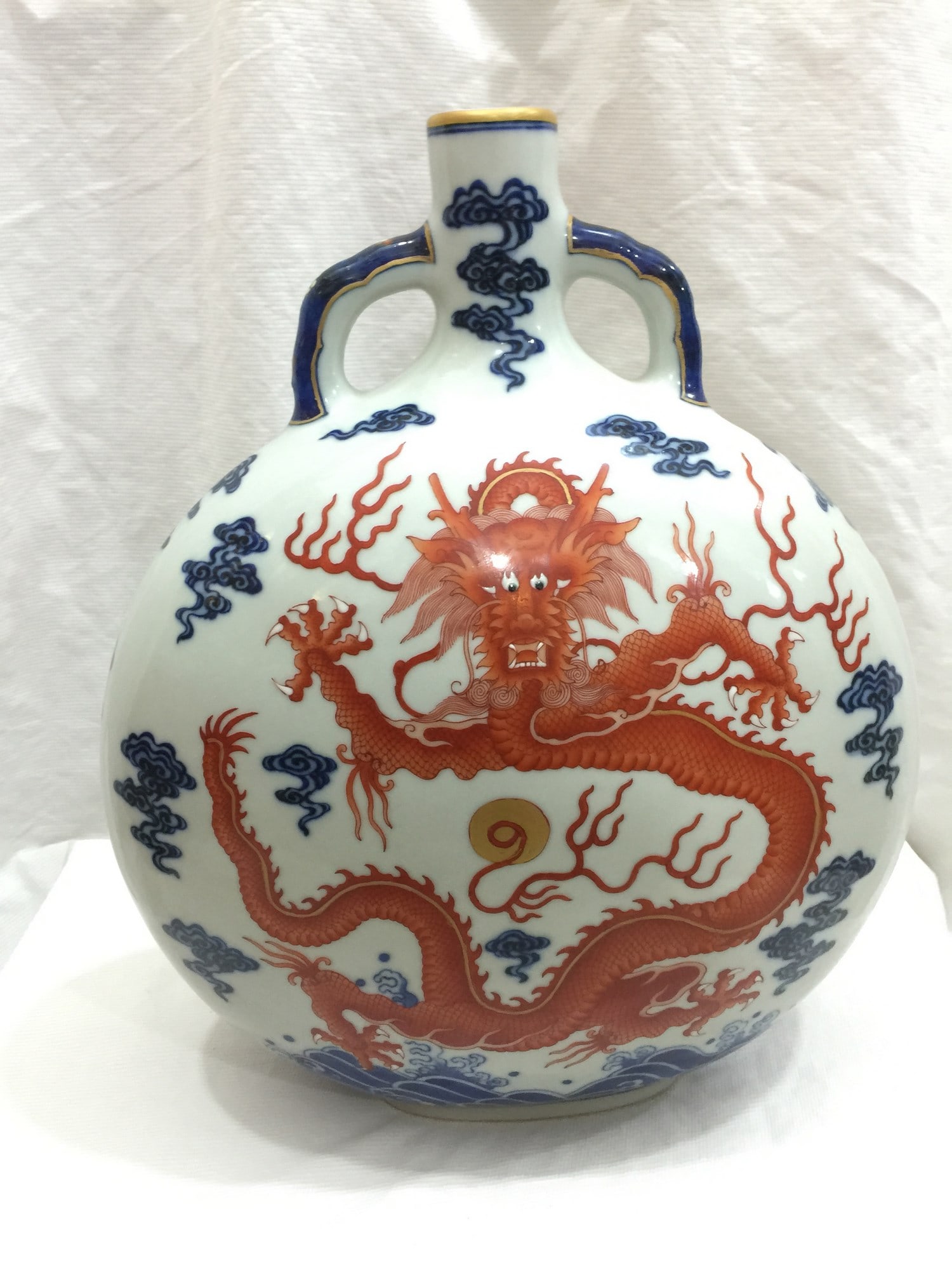 A Blue and White Iron Red Porcelain Dragon Moonflask: Title: A Blue and White Iron Red Porcelain Dragon Moonflask Description: A Blue and White Iron Red Porcelain Dragon Moonflask, Qianlong Mark, H 29cm Materials: Porcelain Reserve: $2,800.00 Shipping: D