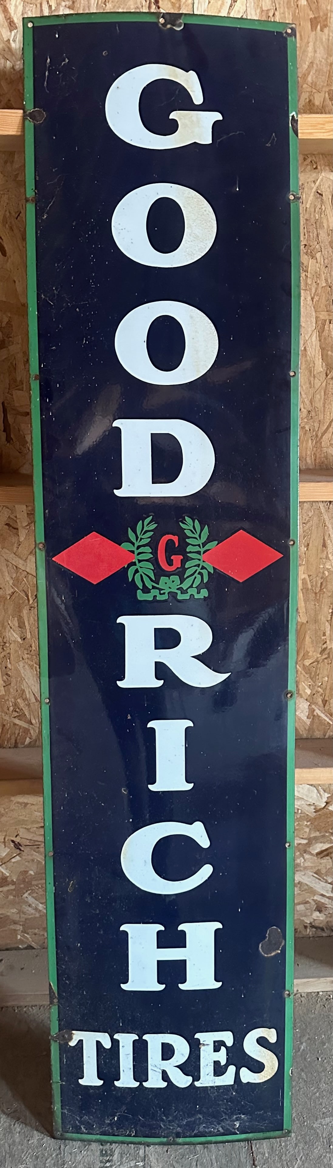 Goodrich Tires Sign: Title: Goodrich Tires Sign Description:Tall vertical Goodrich Tires porcelain sign in navy with green/red trim. Highly decorative and ideal for garage display. Date/Period: 1940s Materials:Porcelain e