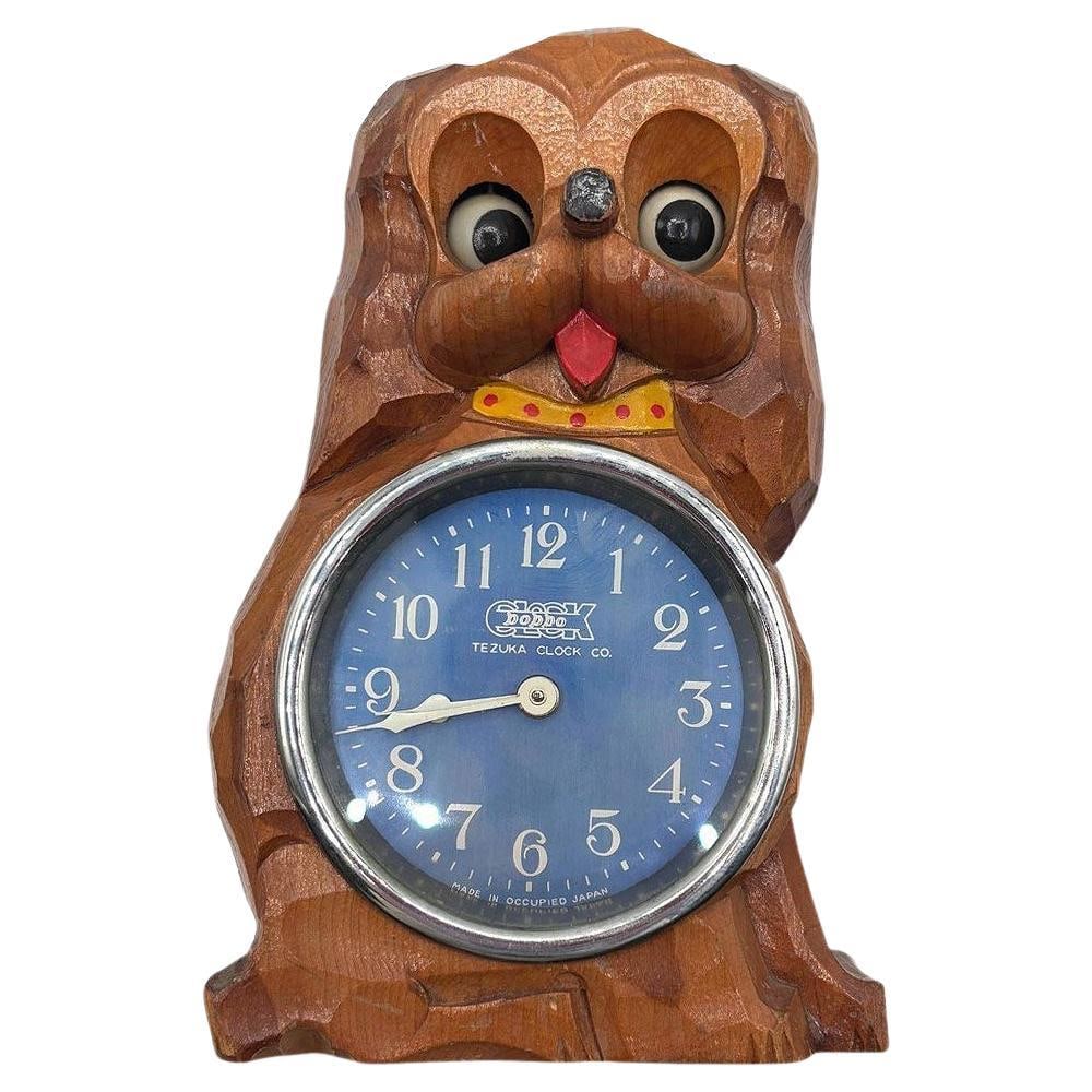 Mid-century Carved "Poppo" Animated Bedside Manual Wind Alarm by Tezuka Clock: About the Item Rare Mid-century animated "Poppo" carved wood figural dog bedside alarm clock by the Tezuka Clock Company in Japan with moving eyes that shift with the movements of the clock hands. Thi