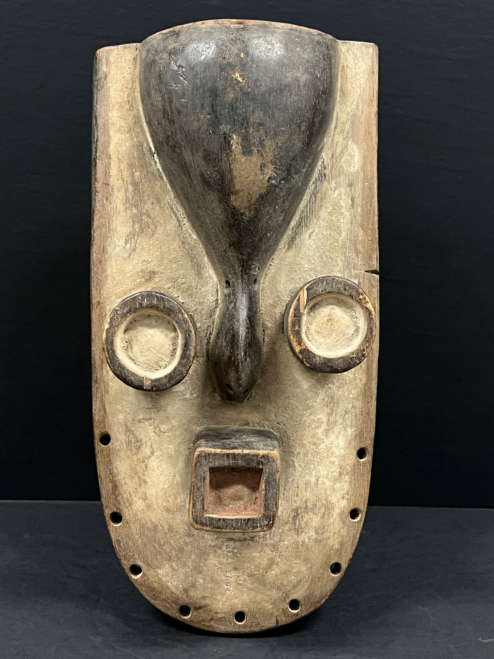 Grebo Mask: Title: Grebo Mask Date/Period: Late 20th Century Dimension: 16" h x 8" w Material: Wood Additional Information: African Tribal Art Grebo Mask Reserve: $80.00 Shipping: Domestic: Flat-rate of $40.00 to