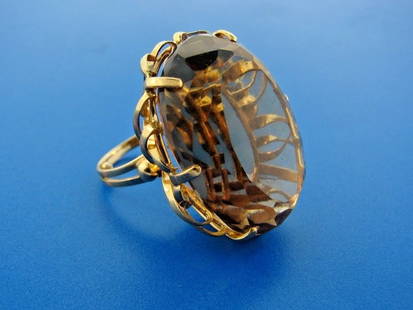 GROOVY 14k Yellow Gold & Citrine Cocktail Ring: DK 14k Yellow Gold & Citrine Cocktail Ring · This is a must for any collector. · The weight is 21.7 grams. · The length is 1 inch. The height is 1 ¼ inches. The width is 5/8 of an