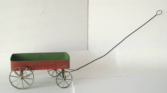 Antique tin toy “EXPRESS” wagon.: Title: Antique tin toy &#8220;EXPRESS&#8221; wagon. Date/Period: 1800's Dimension: Wagon 6&#8221; x 5&#8221; handle 30&#8221; Additional Information: Antique tin toy &#8220;EXPRESS&#8221; wagon made b