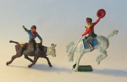 Vintage cast medal rodeo cowboy toys.