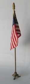 Vintage deck flag with cast iron base.