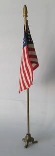 Vintage deck flag with cast iron base.: Title: Vintage deck flag with cast iron base. Date/Period: 1950's Dimension: 13 1/2&#8221; high Additional Information: Nice vintage desk flag with a cast iron base and old gold paint in original cond