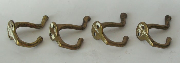 Vintage cast brass coat hooks.