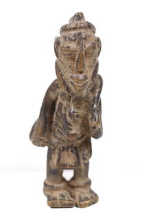 Ancestor Figure – Bronze – Dogon – Mali: A standing Dogon bronze figure from Mali. The Dogon have a highly sophisticated artisan tradition of art and is primarily mirror-images, aproned figures, and standing sculpture. Dogon art revolves aro