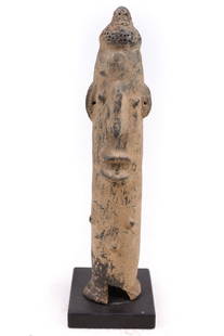 Memorial Head – Bura Asinda-Sikka – Terracotta – Niger: West Africa, Niger, Bura Asinda-Sikka culture, ca. 3rd to 11th century CE. A fine hand-built terracotta memorial head of a characteristically phallic form resting atop a flared base. The abstract visa