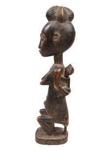 Maternity Figure – Wood – Guro – Ivory Coast: Very appealing refined carved African wooden maternity figure from the Guro people of Ivory Coast. Beautifully designed with a warm expression. Exhibiting a wide diversity in size, symbolism, intimacy
