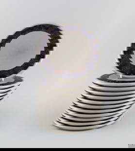 Twelve Bing & Grøndahl Mexico butter boards in glazed stoneware. Model number 950. Danish: Twelve Bing & Gr&#248;ndahl Mexico butter boards in glazed stoneware. Model number 950. Danish design, 1970s / 80s. Diameter: 16.5 cm. In excellent condition. Stamped. Reserve: $350.00 Shipping: Domes