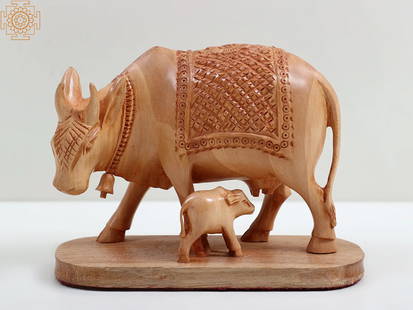 5" Small Mother Cow Wooden Sculpture with Calf: Title: 5" Small Mother Cow Wooden Sculpture with Calf Description: Wood Statue Height: 4 inch Width: 5.4 inch Depth: 2.35 inch Weight: 170 gm Additional Information: Experienced serenity and enlighten