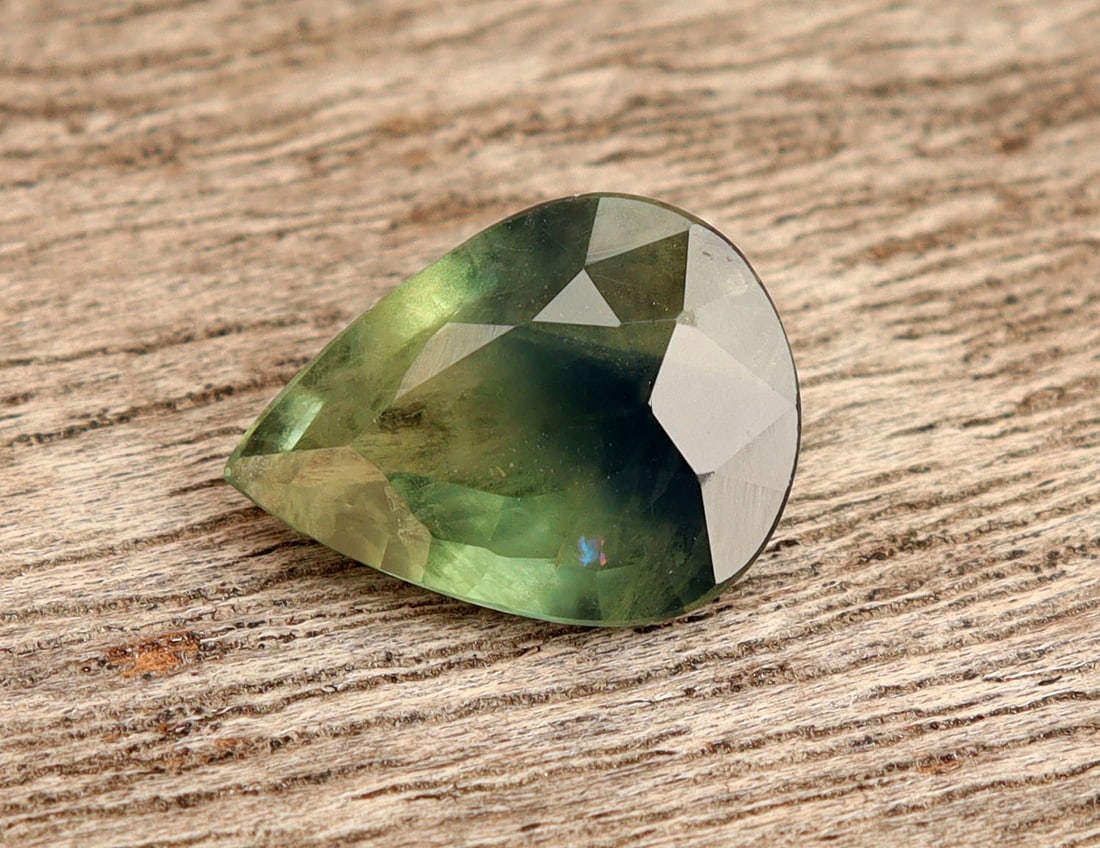 Natural Green Teal Sapphire 2.01 Carat Pear Cut: Title:Natural Green Teal Sapphire 2.01 Carat Pear Cut Additional Info:Gemstone: Natural SapphireCarat Weight: 2.01Shape/Cut: Pear CutDimension: 9.83x7.37x3.69 mmColor: Blueish GreenTransparency: Trans