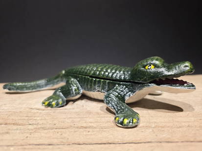 8 1/5" Cast Iron Alligator Match holder, Trinket box: 8 1/2" Long Wonderful reproduction vintage style match holder, trinket box, or stash box, often featuring a hinged back or a compartment for storage 100% Customer Satisfaction Guarantee We stand behin