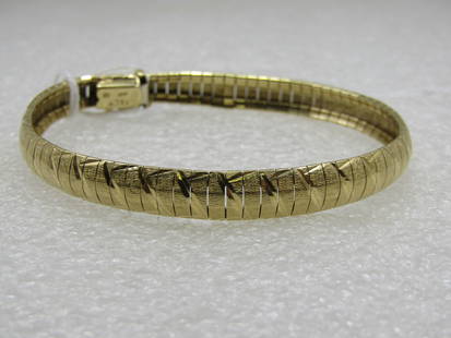 14kt Textured Omega Link Bracelet, 7", 7mm: Title:14kt Textured Omega Link Bracelet, 7", 7mm Description:14kt Textured Omega Link Bracelet, 7", 7mm wide, Signed DG. Marked 14kt Italy, tested, weight is appx 10 dwt. Very good condition. (INV. W1