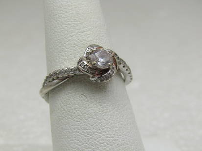 Silver Plated Engagement Rings, Sz. 7.5, Signed BBCN and .925: Silver Plated Engagement Rings, Sz. 7.5, Signed BBCN and .925. This does test as .925 however it is likely plated as you can see copper type metal poking through. It is a very pretty design and seems