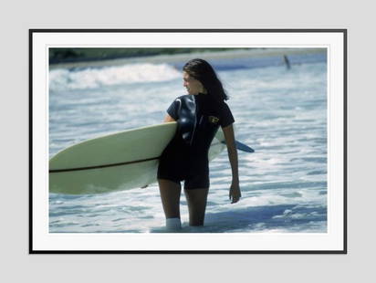 Slim Aarons 'Minnie Cushing' 1965 Oversize Black Frame C Type Print: Description Slim Aarons 'Minnie Cushing' 1965 Oversize Black Frame c type print American society girl Minnie Cushing carries her surfboard under her arm, September 1965. Black Frame C Type Print Print