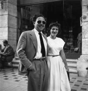 Slim Aarons 'Via Veneto' Unframed Silver Gelatine Fibre Print: Description Slim Aarons 'Via Veneto' Unframed Silver Gelatine Fibre Print American playwright Tennessee Williams (1911 &#8211; 1983) and a lady friend standing on the Via Veneto outside the Excelsior