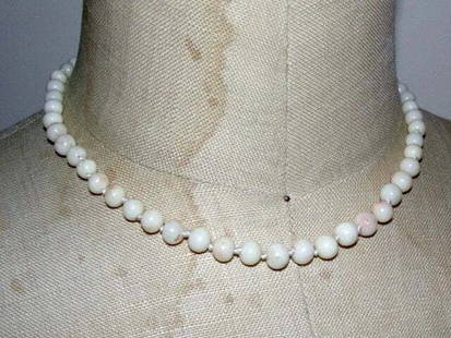 Small Angel Skin Coral Bead Necklace: Title: Small Angel Skin Coral Bead Necklace Description: Gorgeous angel skin coral necklace. Adorable. Freshly knotted on white silk. Necklace measures 16 1/2" . Closes with a sterling silver filigree