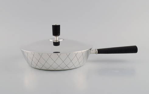 Sigvard Bernadotte for Georg Jensen. Rare casserole in sterling silver with handle and lid knob in: Title:Sigvard Bernadotte for Georg Jensen. Rare casserole in sterling silver with handle and lid knob in ebony. Model number 909C. Description:Sigvard Bernadotte for Georg Jensen. Rare casserole in st