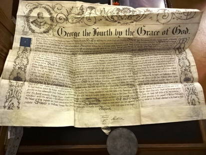 1826 Beautiful English Manuscript Recovery Great Seal: A beautifully penned Recovery document from the sixth year of the reign of King George IV, 1826 pertaining to property in Devonshire. Elaborate printed borders with initial letter with large portrait
