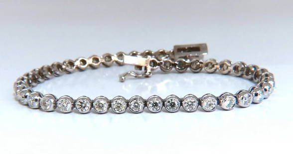 3.07 carat natural round diamonds tubular flush link tennis bracelet 14kt: Diamond tennis flush link tubular bracelet. Bracelet will not catch on any knit or thread. Smooth high polish shine finish. 3.07 carat natural round diamonds. I- color vs2 clarity. 14kt white gold 9.7