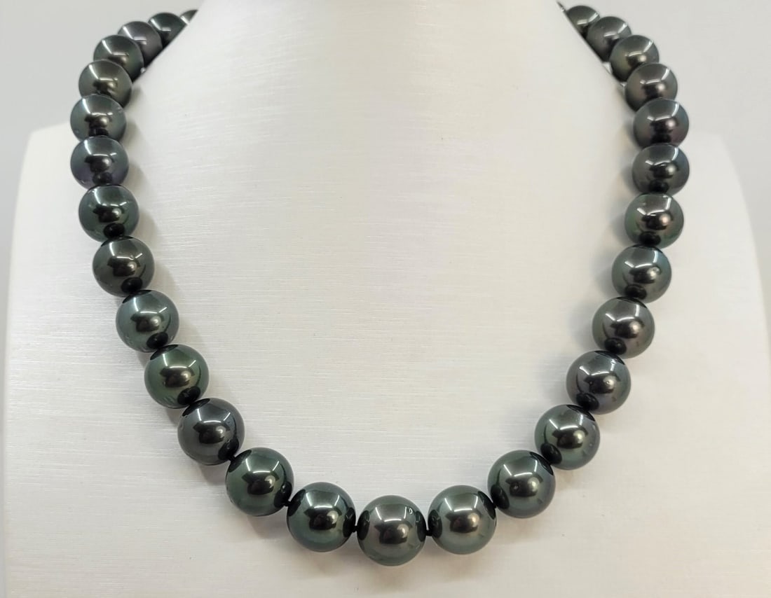 PSL Certified Tahitian Pearls - 10.1x12.1mm Necklace: Title: PSL Certified Tahitian Pearls - 10.1x12.1mm Necklace Description: This necklace is in the category of the Tahitian Pearls according to the tested results and the P.S.L criteria. Emerging from t