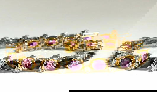 12.90ct Natural Ruby Diamonds Bracelet 14 Karat Two Toned: Ruby Diamond Durable Link. 10.80ct Natural Ruby bracelet. Ovals Full Cut brilliants, transparent & clean clarity. Bright purple pink colors. Average 4x5mm each. Round full cut natural Diamonds: 2.10ct