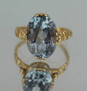 Vintage Aquamarine and 18 Carat Gold Ring, London, 1988: Vintage 18ct Gold Aquamarine Ring &#8211; Hallmarked London, 1988 This vintage 18ct gold ring features an oval-cut aquamarine, approximately 11 carats, set in a simple yet elegant 18ct yellow gold ban