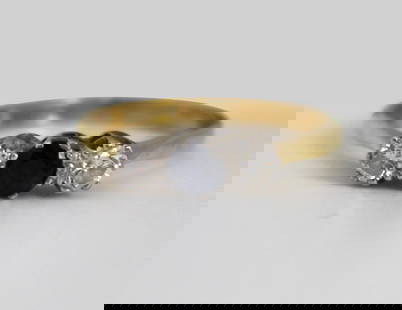 Sapphire & Diamond 18ct Gold Ring: Sapphire & Diamond 18ct Gold Ring. Ring size: M (British) / 6.25 (US). Weight: 2.4 g. Sapphire approximately 4mm in diameter. The two diamonds approximately 3 mm in diameter. Yellow 18ct gold shank, f